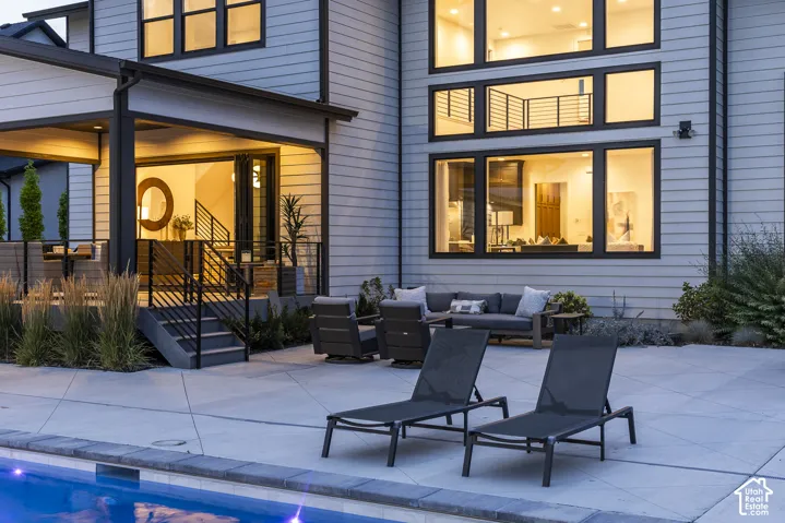 Modern exterior with light-toned horizontal siding and dark-framed windows