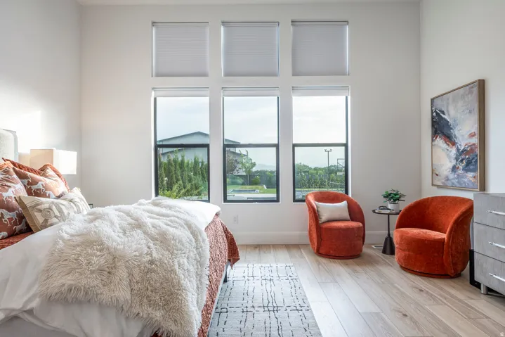 Expansive window arrangement with three upper transom windows and three lower windows featuring black frames