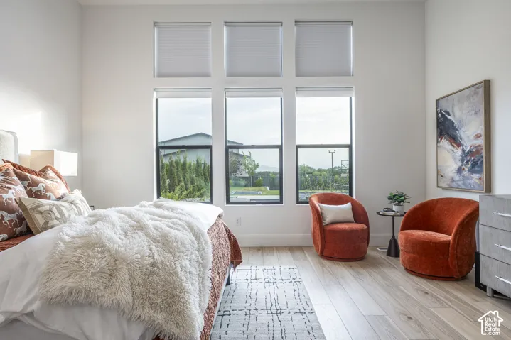Expansive window arrangement with three upper transom windows and three lower windows featuring black frames