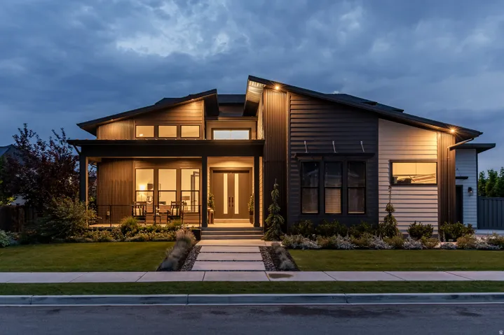 Modern exterior architecture featuring a multi-pitched roofline and a combination of vertical and horizontal siding