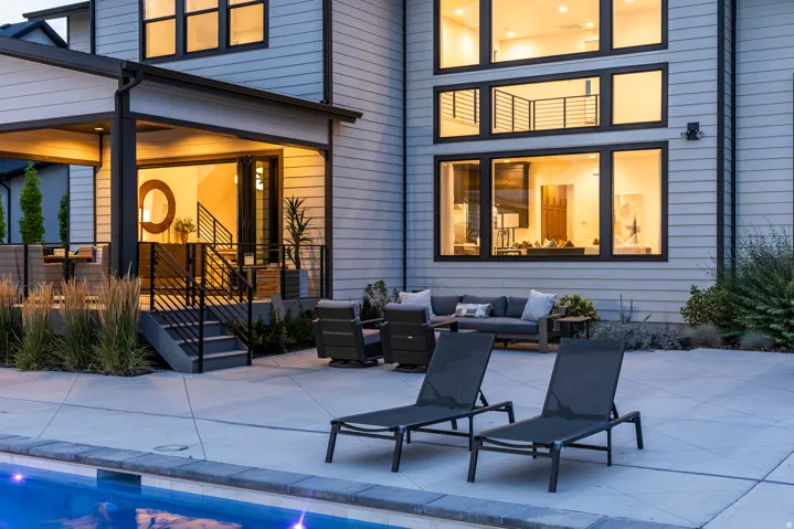 Modern exterior with light-toned horizontal siding and dark-framed windows