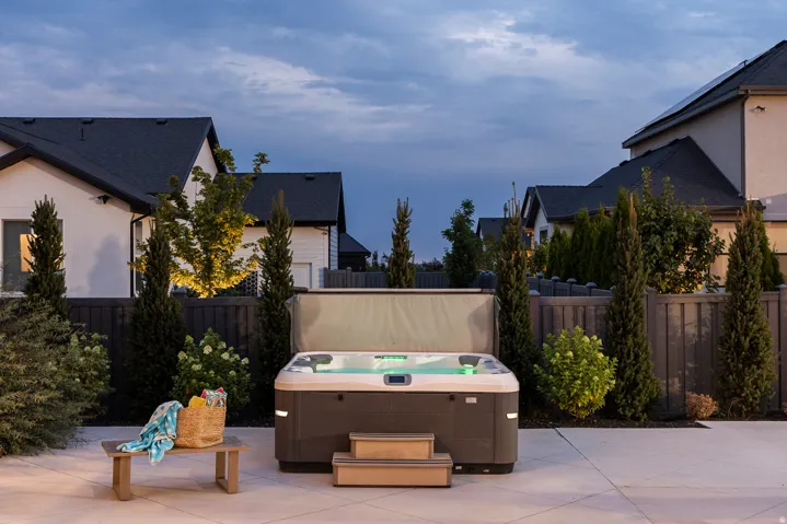 Outdoor spa featuring integrated lighting and exterior steps
