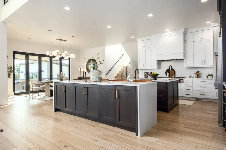 Open-concept kitchen with light wood-finish flooring