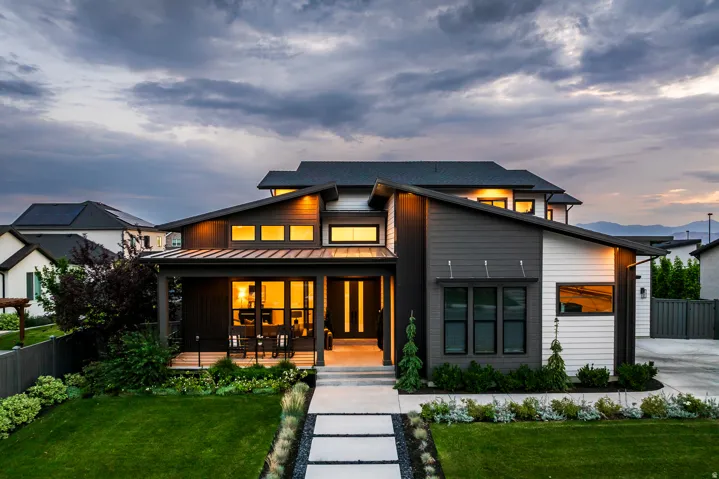 Modern architectural style residence featuring a prominent covered front patio