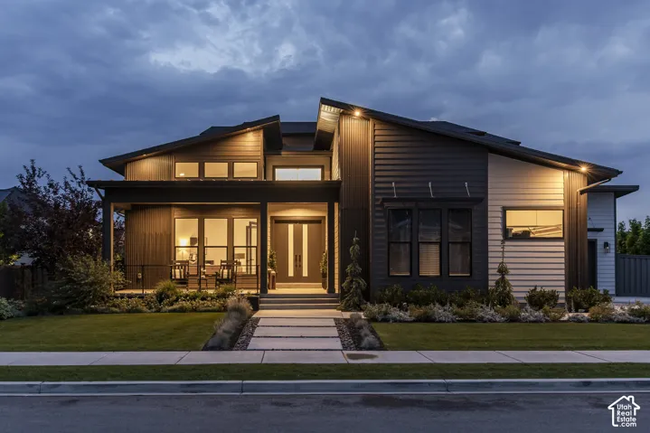 Modern exterior architecture featuring a multi-pitched roofline and a combination of vertical and horizontal siding