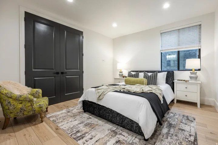Light wood-finish flooring with white baseboards throughout