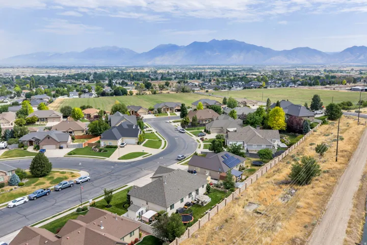 Aerial perspective showcasing a residential development with a mountain backdrop