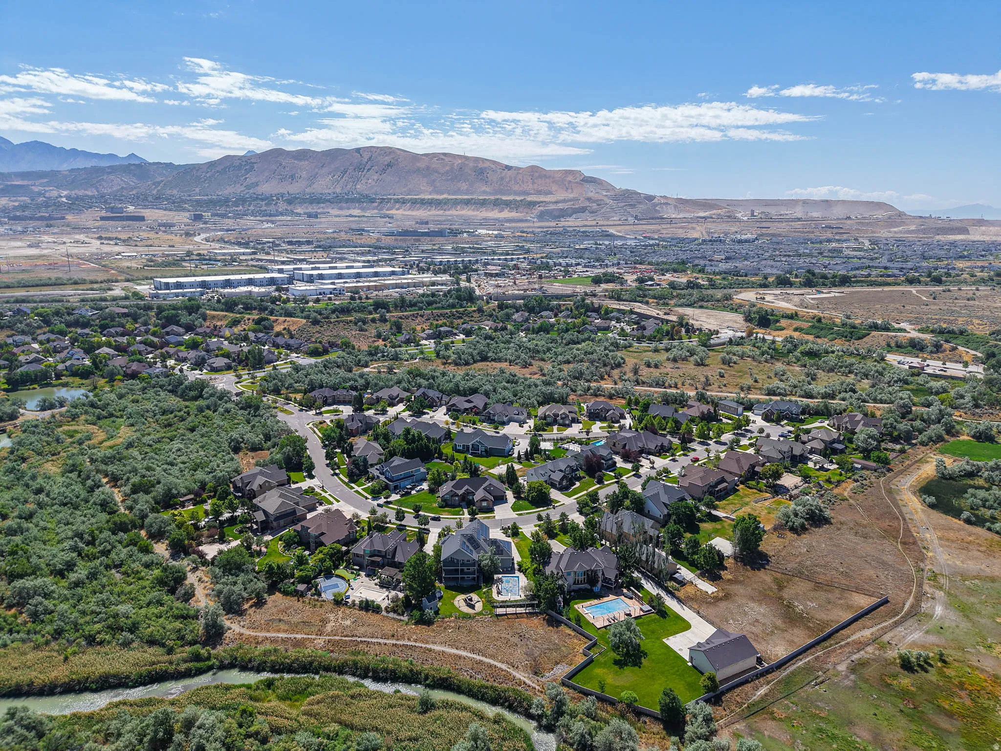 Expansive residential community with established homes, paved streets, and mature landscaping