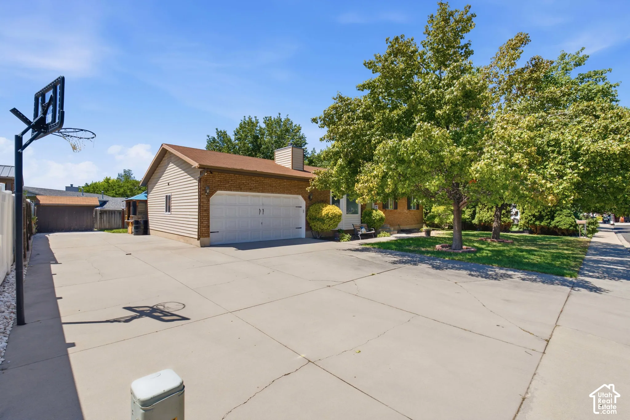 Brick and siding exterior with a two-car garage
