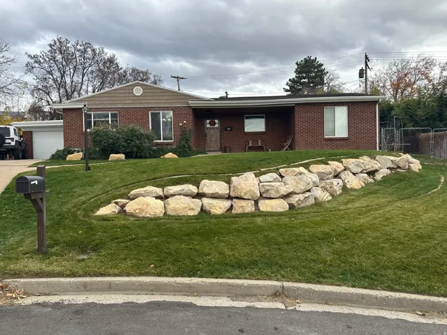 Brick exterior with a shingle accent gable and integrated garage