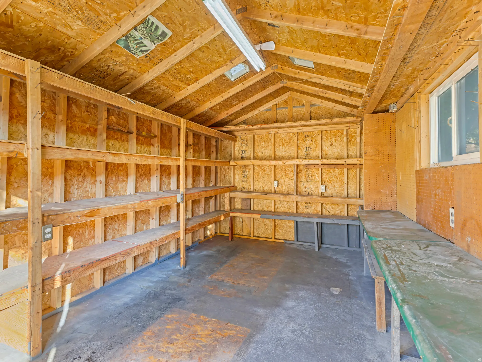 Utility structure with exposed wood-finish walls and ceiling