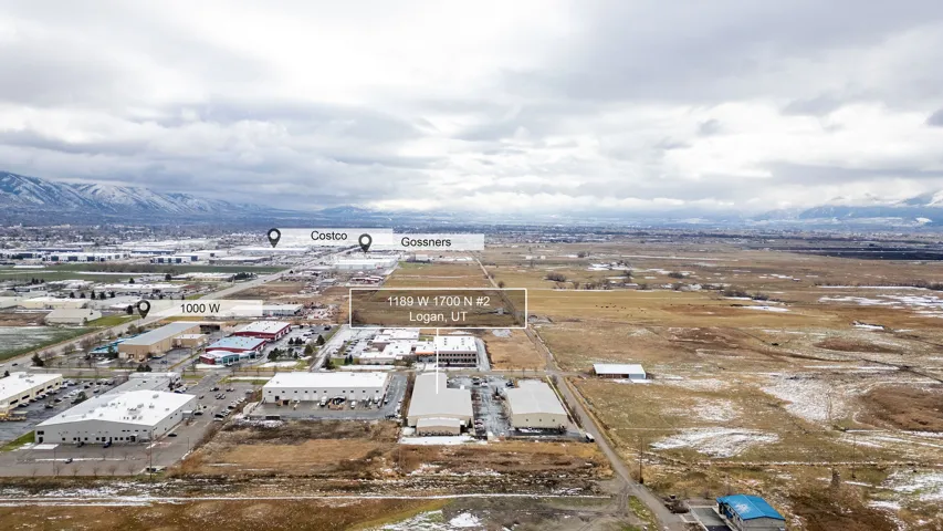 Aerial perspective showcasing a commercial property within a developed area