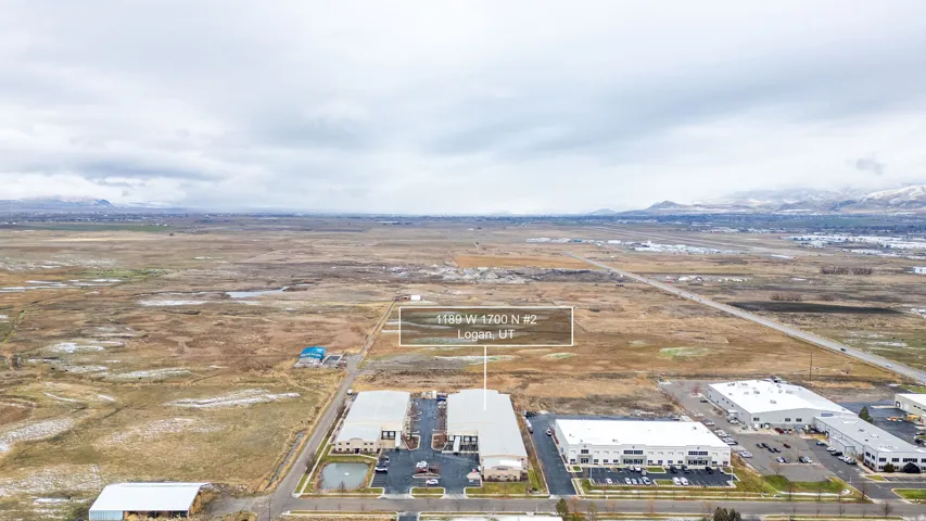 Aerial perspective highlighting the property with a broad, flat landscape