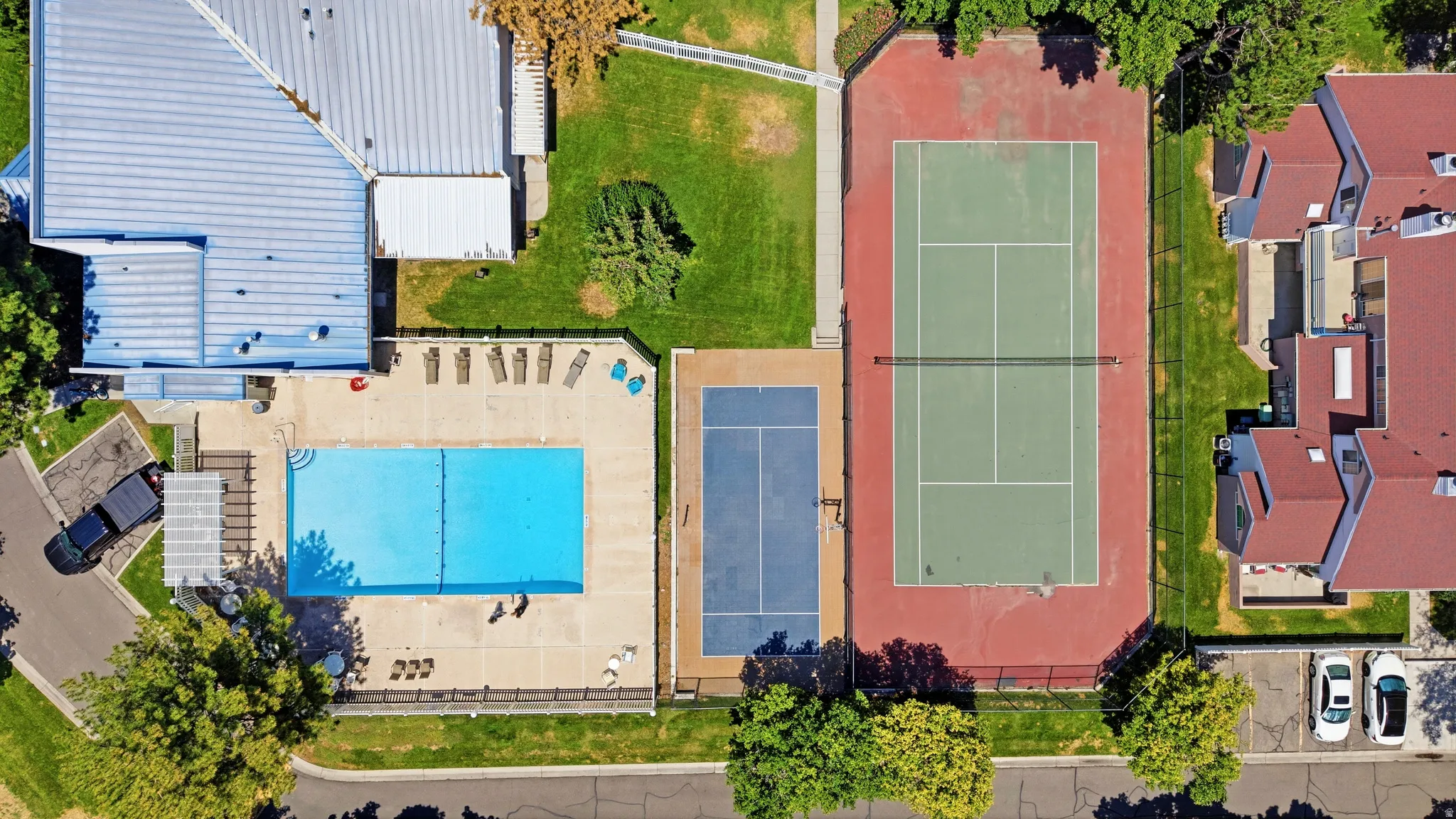 Community amenities featuring a swimming pool, tennis court, and sports court