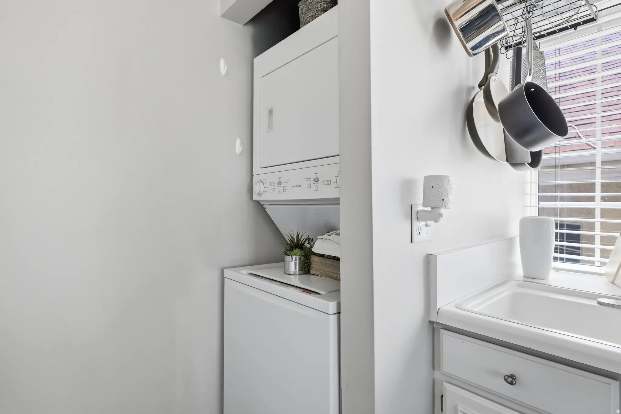 Compact laundry area with a stacked washer and dryer unit