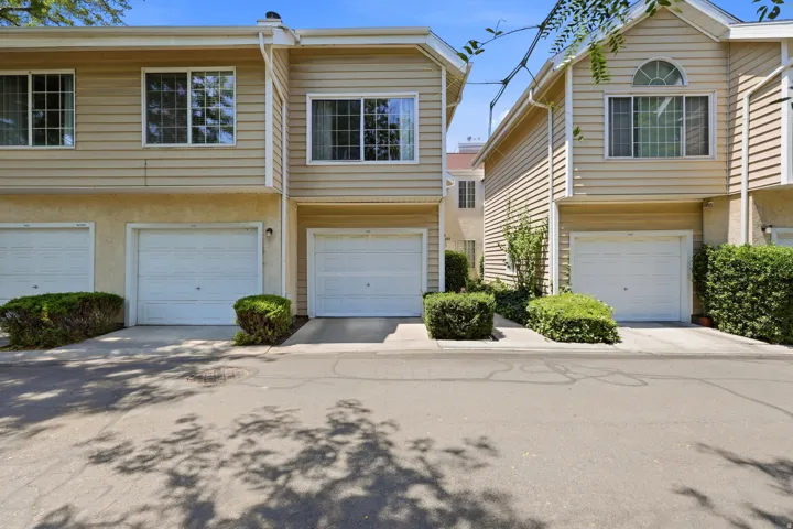 Multi-level exterior featuring horizontal siding and stucco finishes