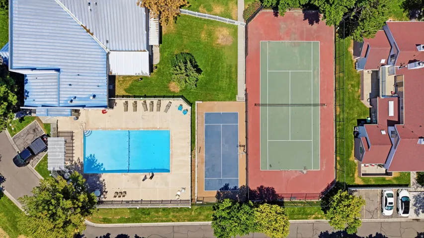 Community amenities featuring a swimming pool, tennis court, and sports court