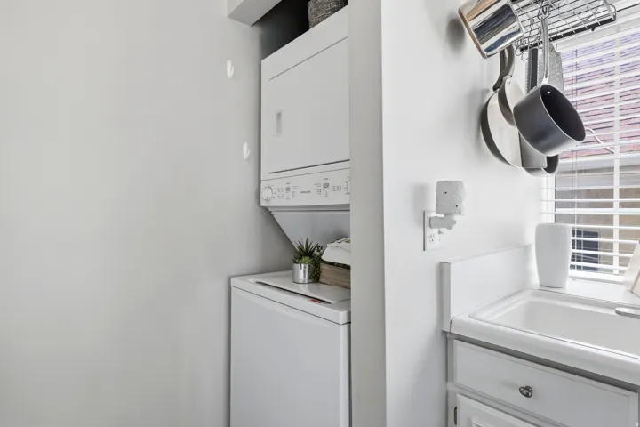 Compact laundry area with a stacked washer and dryer unit
