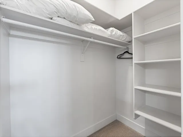 Built-in closet system featuring shelving and hanging rod