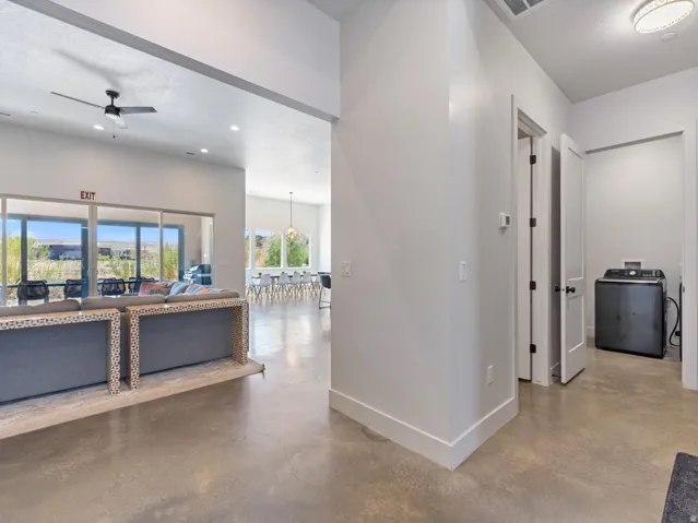 Polished concrete flooring extends throughout open-concept interiors