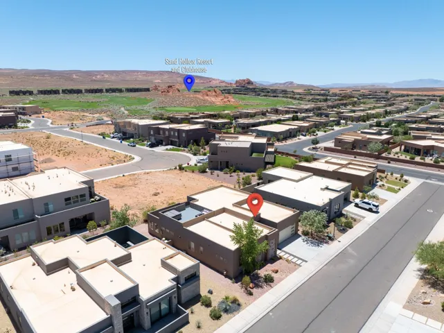 Modern desert community featuring flat-roof architecture and paved streets