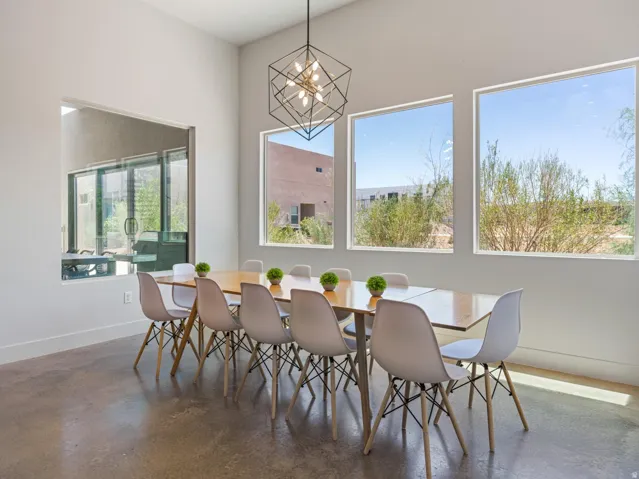 High ceilings complement a contemporary geometric chandelier