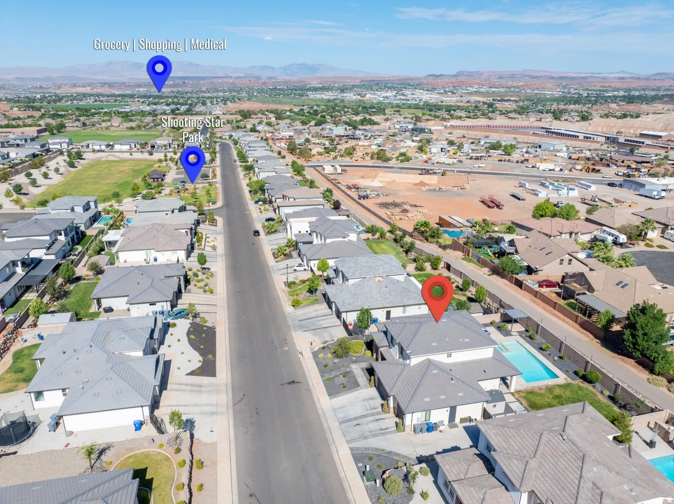 Aerial perspective showcasing a residential street with modern homes, several featuring private swimming pools