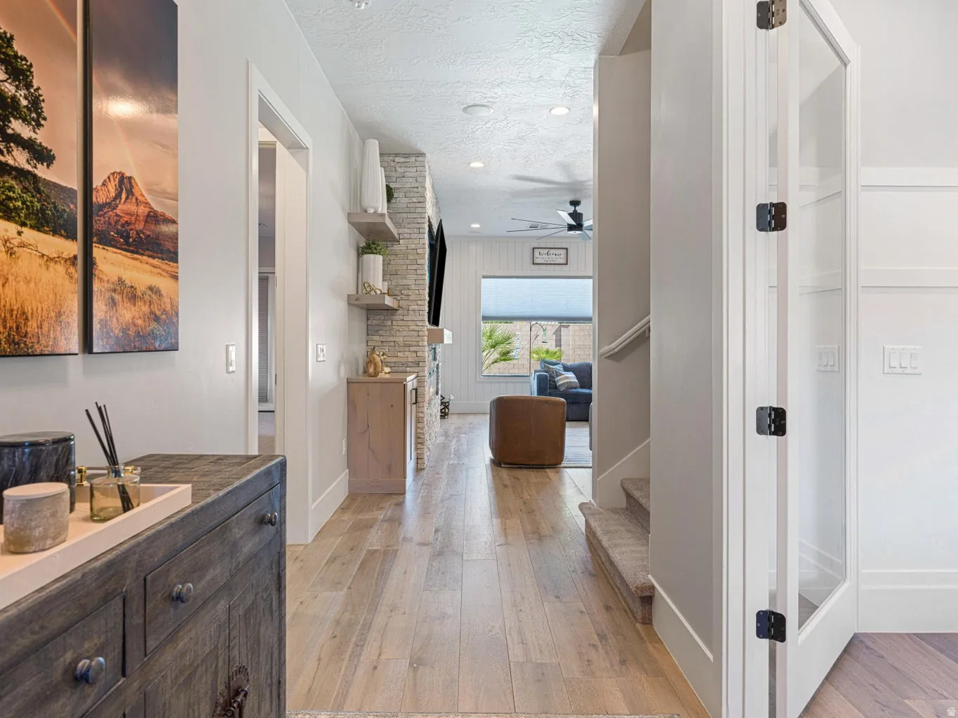 Light wood-finish flooring extending through an open-concept interior