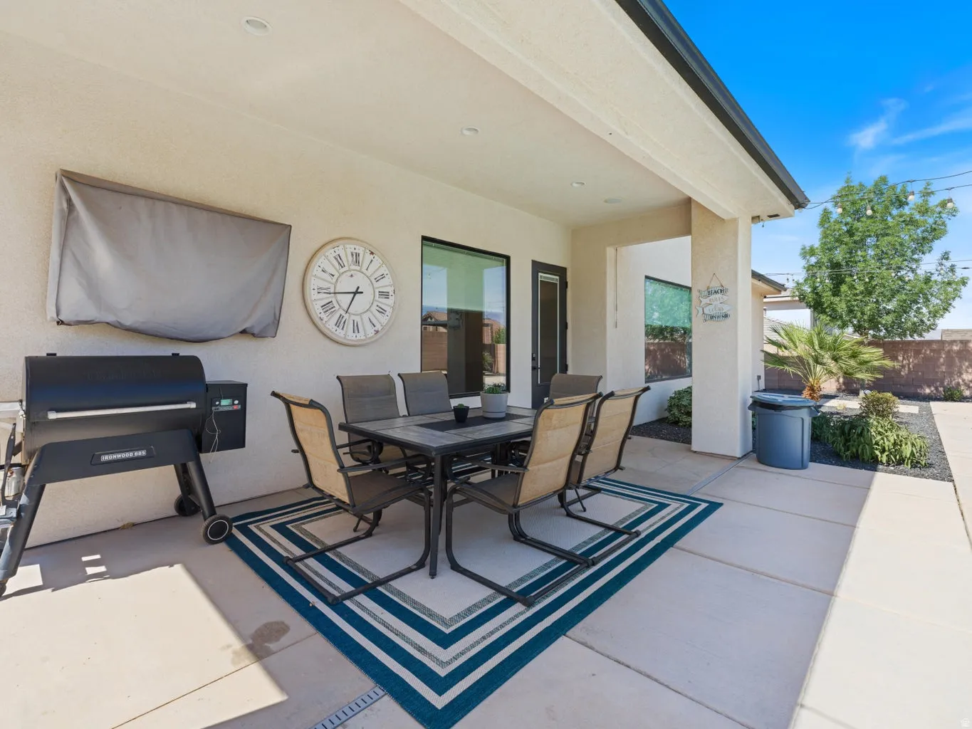 Covered patio featuring concrete flooring, recessed lighting, and direct access to interior spaces