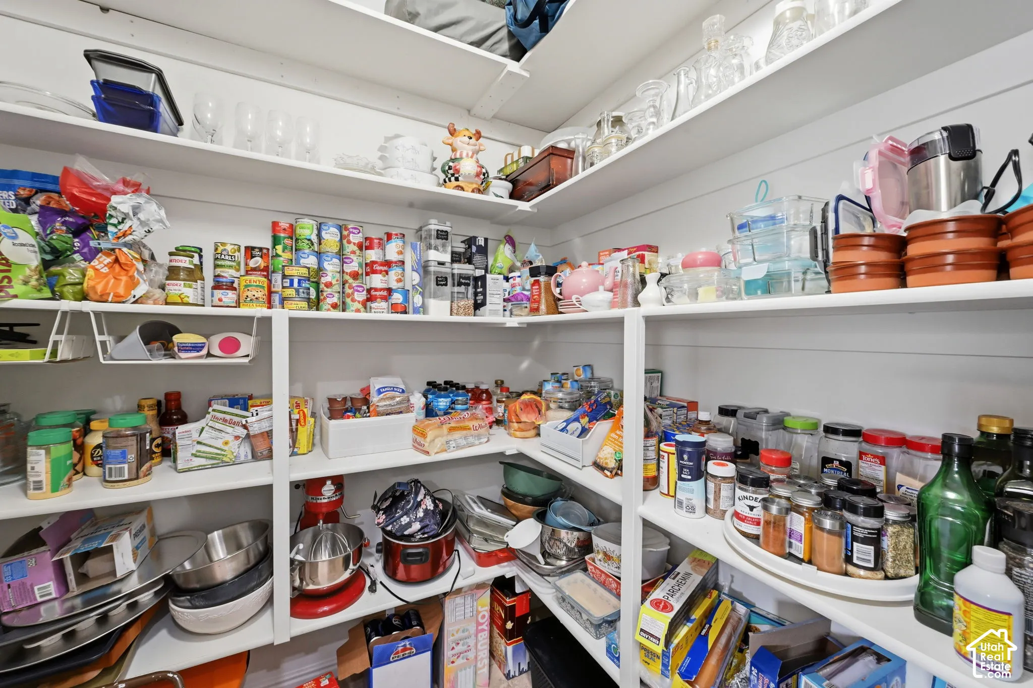 Built-in pantry shelving featuring white painted wood construction