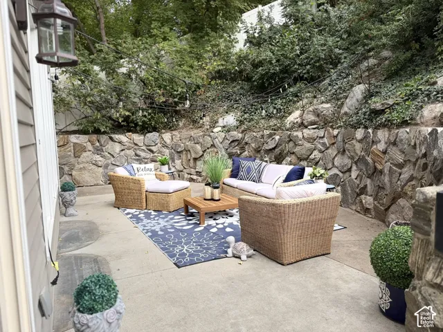 Poured concrete patio with stacked stone retaining walls