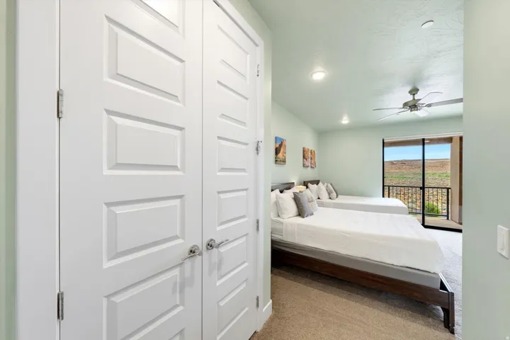 Bedroom featuring a sliding glass door to an exterior balcony, ceiling fan, recessed lighting, and light-toned walls