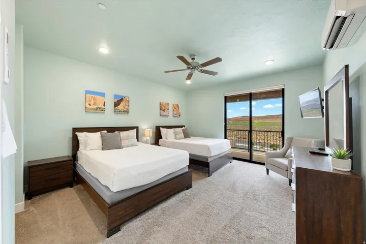 Bedroom featuring a glass sliding door, carpet flooring, a ceiling fan, and recessed lighting