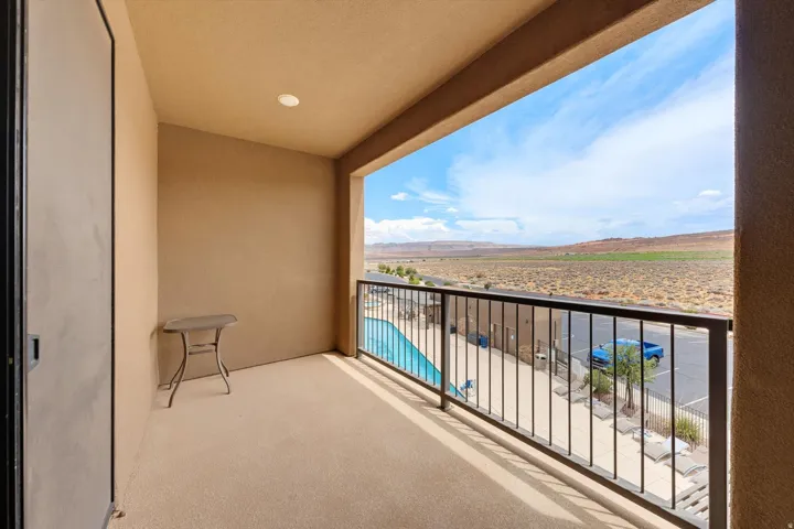 Covered balcony with textured stucco walls