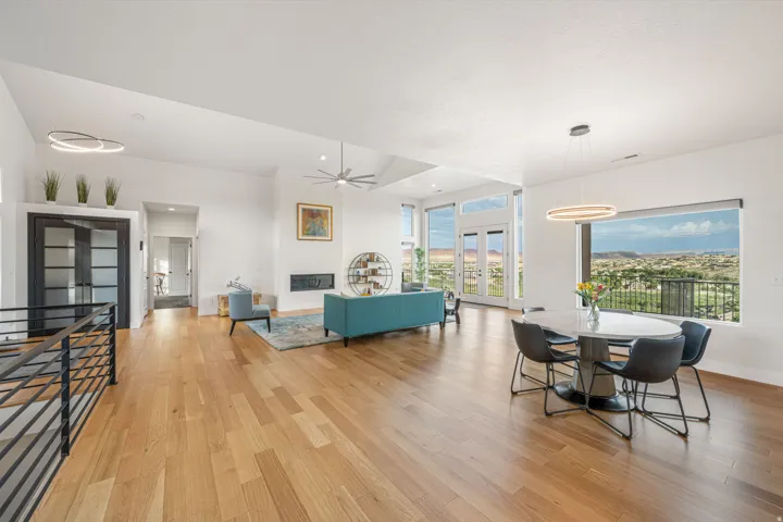 Expansive living area with wood-finish flooring and vaulted ceilings