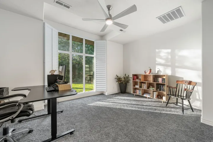 Room featuring a vaulted ceiling, a ceiling fan, and recessed lighting