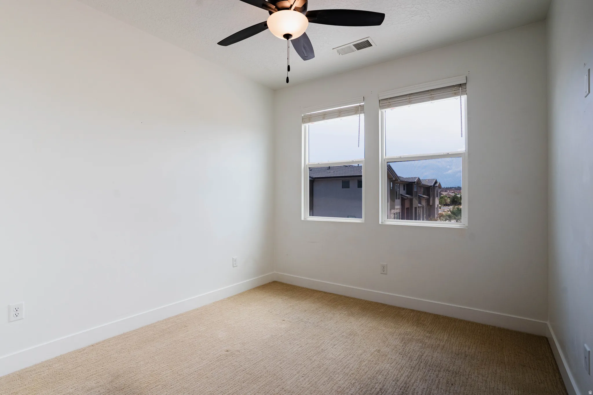 Neutral-toned carpeting spanning the floor