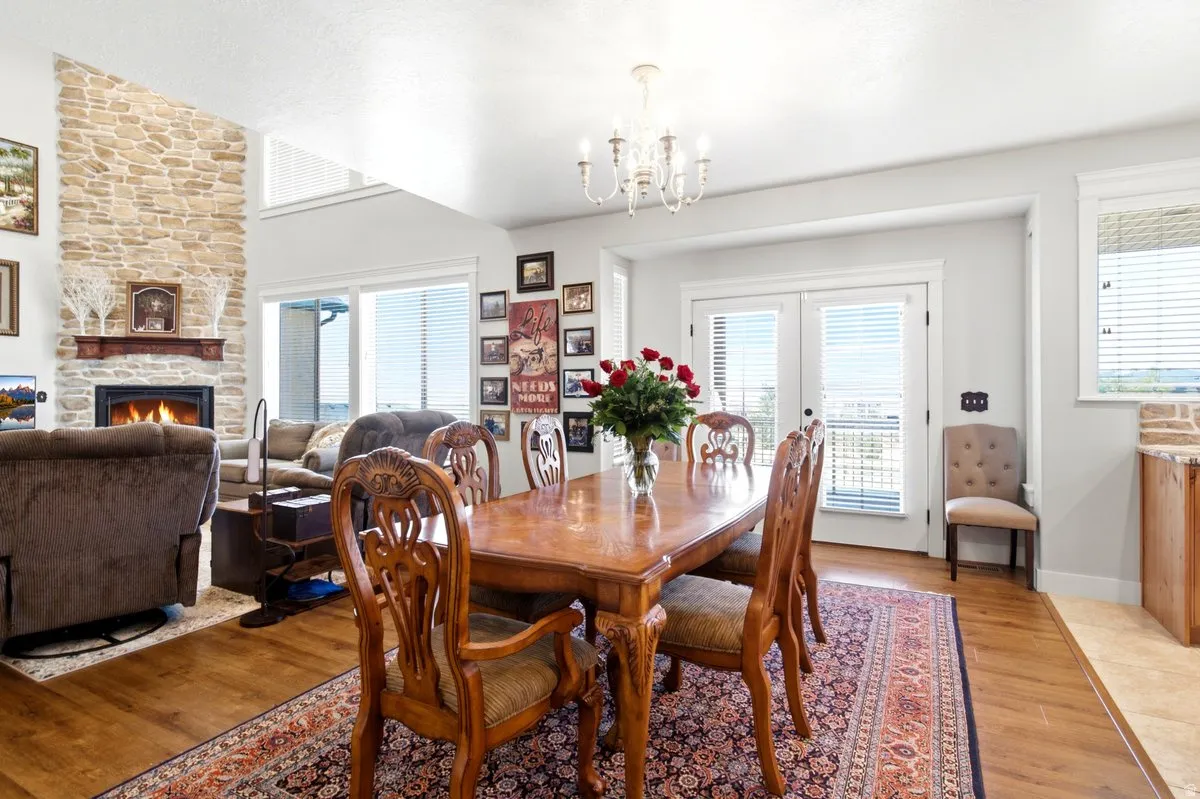 Dining area featuring wood-finish flooring and a decorative chandelier