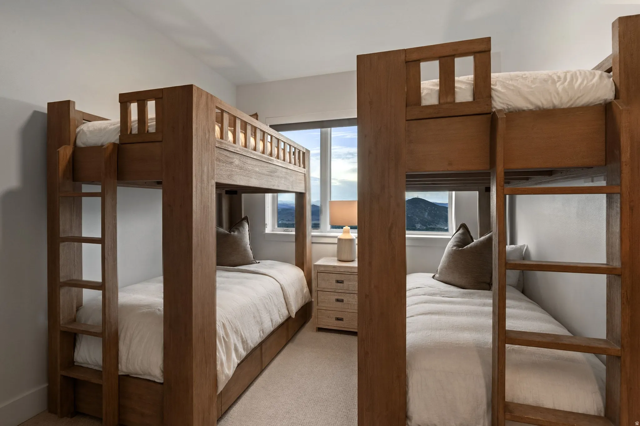 Double bunk beds featuring integrated ladders and storage drawers