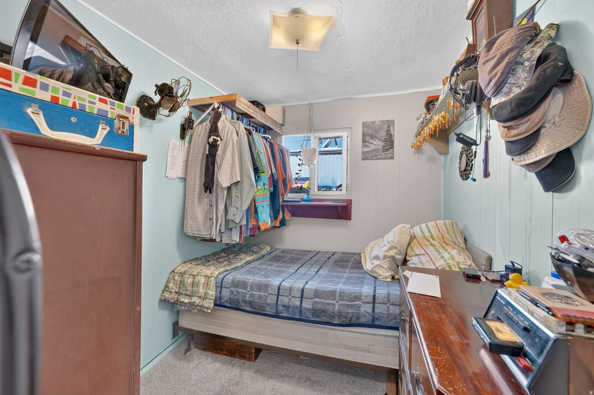 Compact room with light blue and white paneled walls