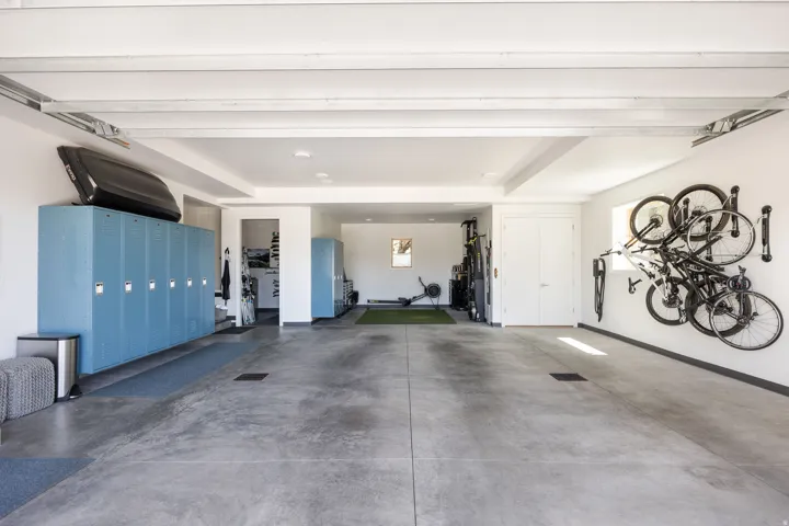 Spacious garage featuring concrete flooring and white walls