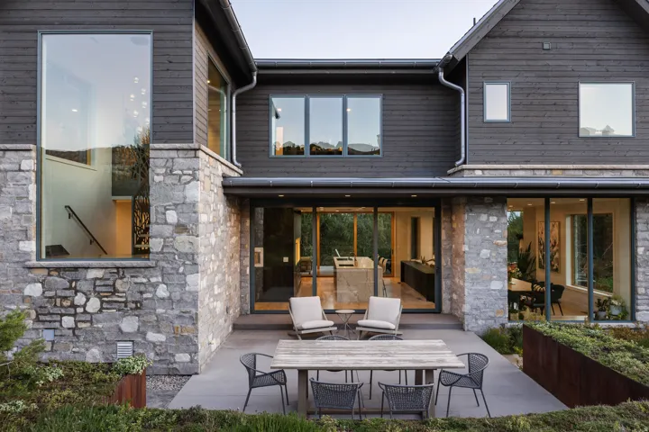 Modern architectural exterior featuring mixed-material siding and extensive glazing