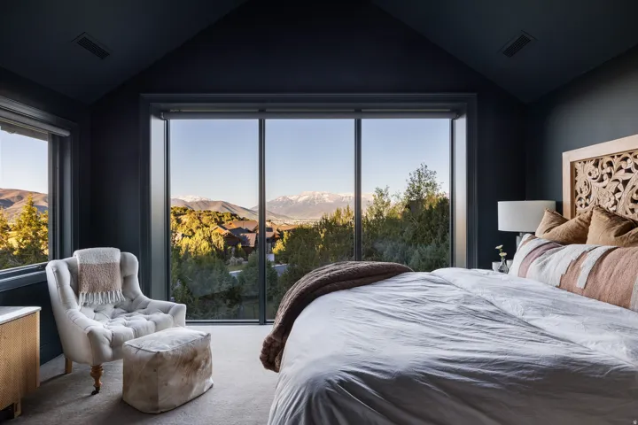 Expansive floor-to-ceiling window offering mountain scenery