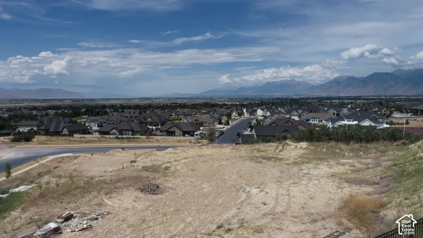Graded lot with expansive mountain and suburban scenery