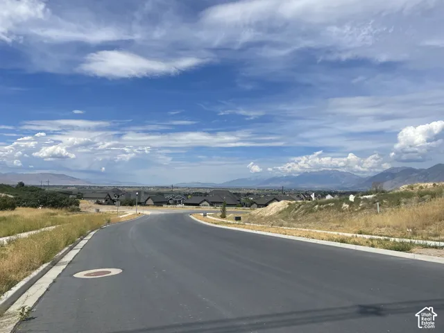 Newly paved road with curbing and sidewalk