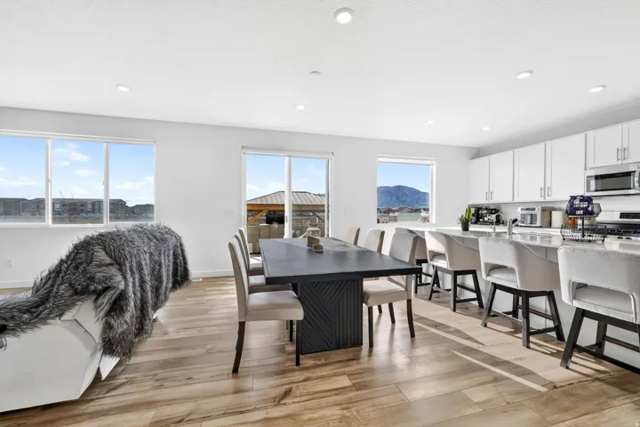 Open-concept living area with wood-finish flooring
