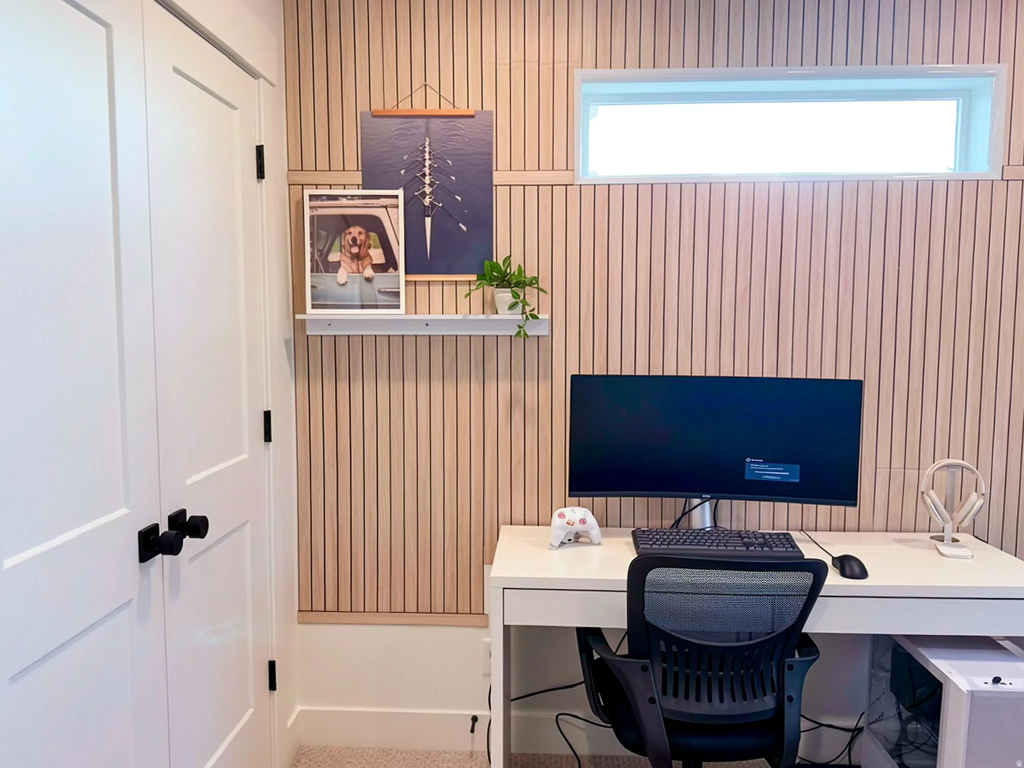 Accent wall featuring vertical wood paneling