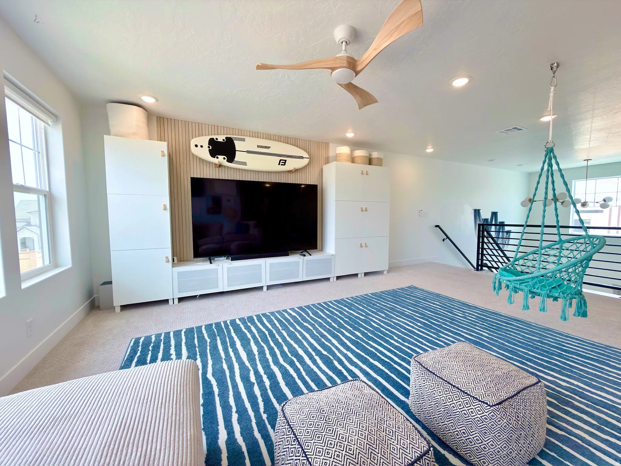 Spacious loft area featuring a natural wood ceiling fan, recessed lighting, and wall-to-wall carpeting