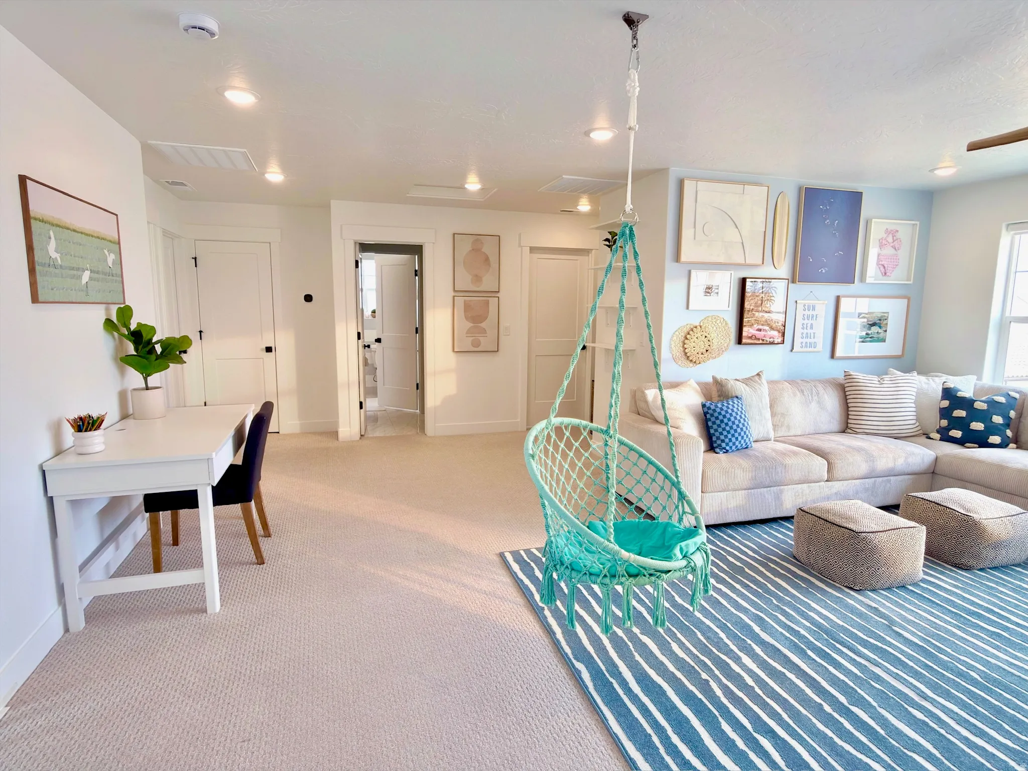 Versatile bonus room featuring recessed lighting, light-toned carpeting, and a built-in desk area