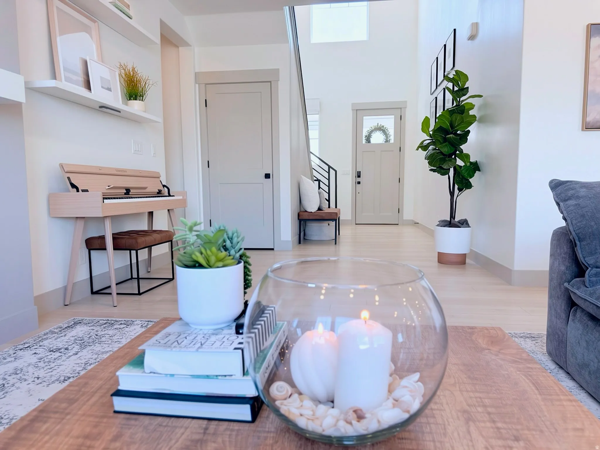 Light wood-finish flooring extending from the entryway